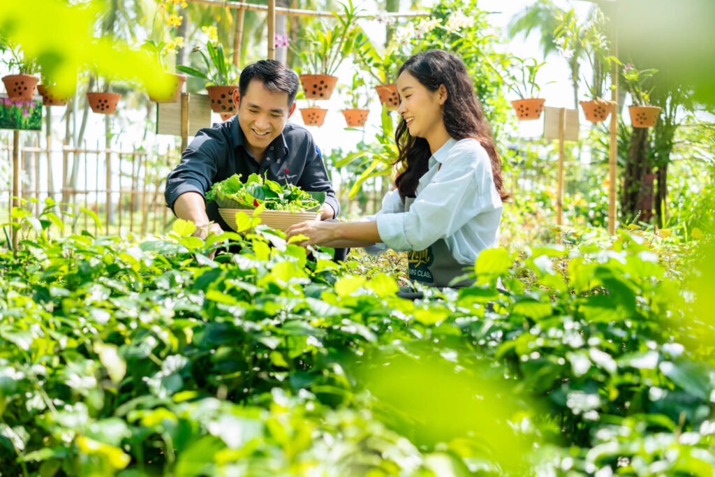 A woman explores the herb garden with the chef at Danang Marriott Resort & Spa in Vietnam.