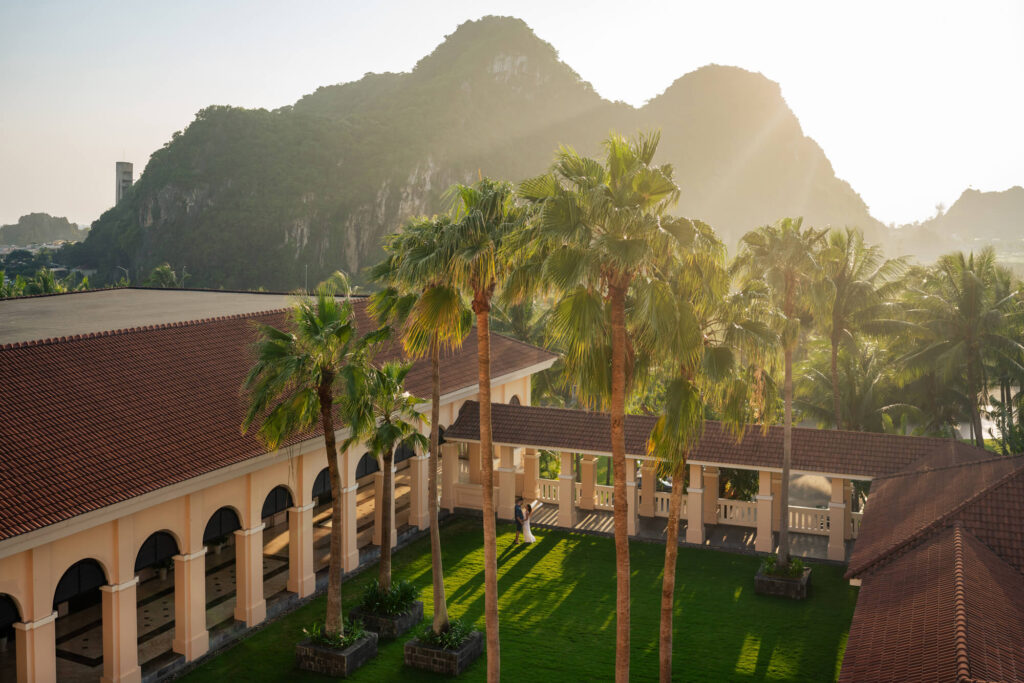 A couple strolls around the Danang Marriott Resort & Spa in Vietnam.