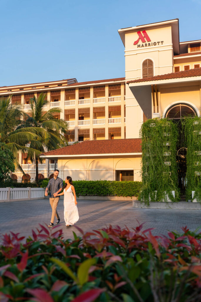 A couple strolls around the Danang Marriott Resort & Spa in Vietnam.