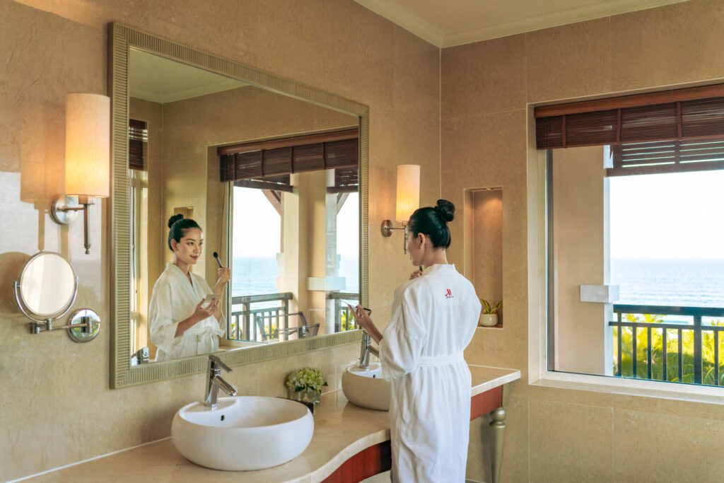 A woman enjoys a bath with a view at a luxury resort in Vietnam.