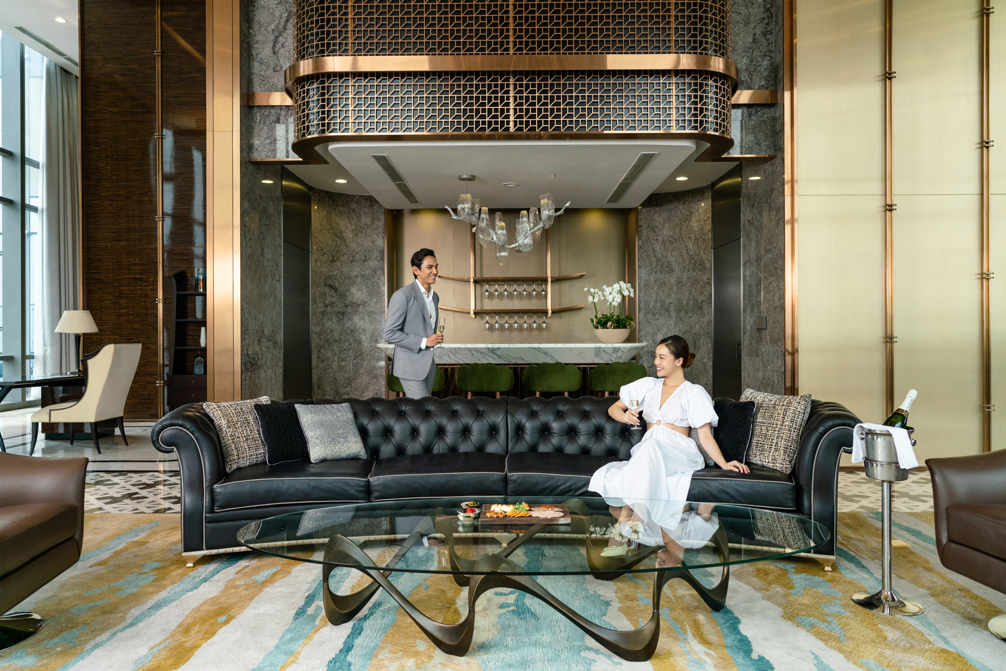 A couple enjoys a luxury stay in a presidential suite at a five star hotel