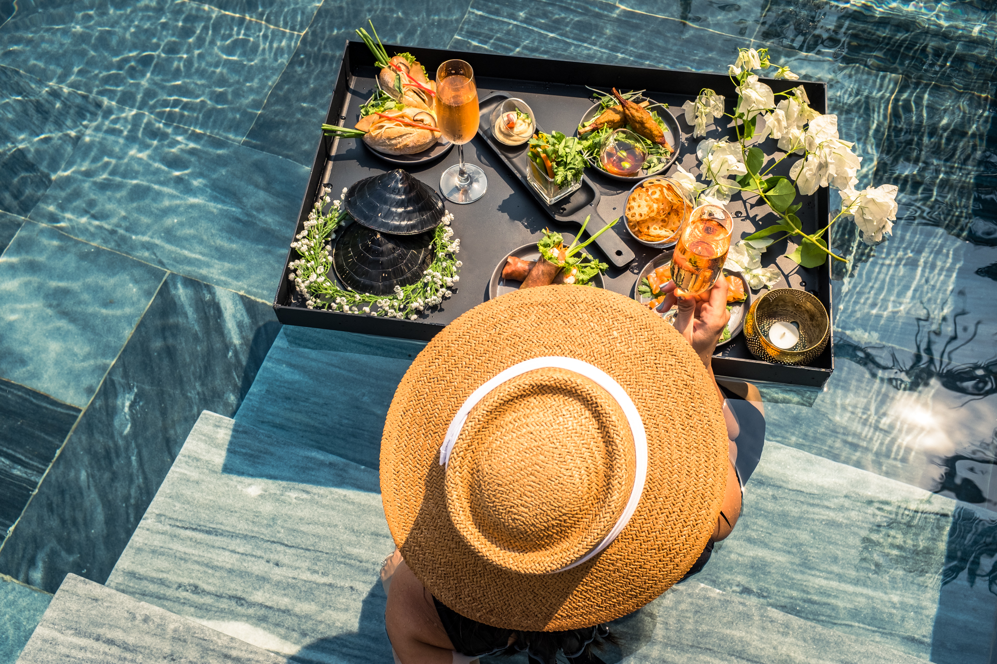 Floating breakfast is enjoyed at a pool at a luxury resort in Vietnam