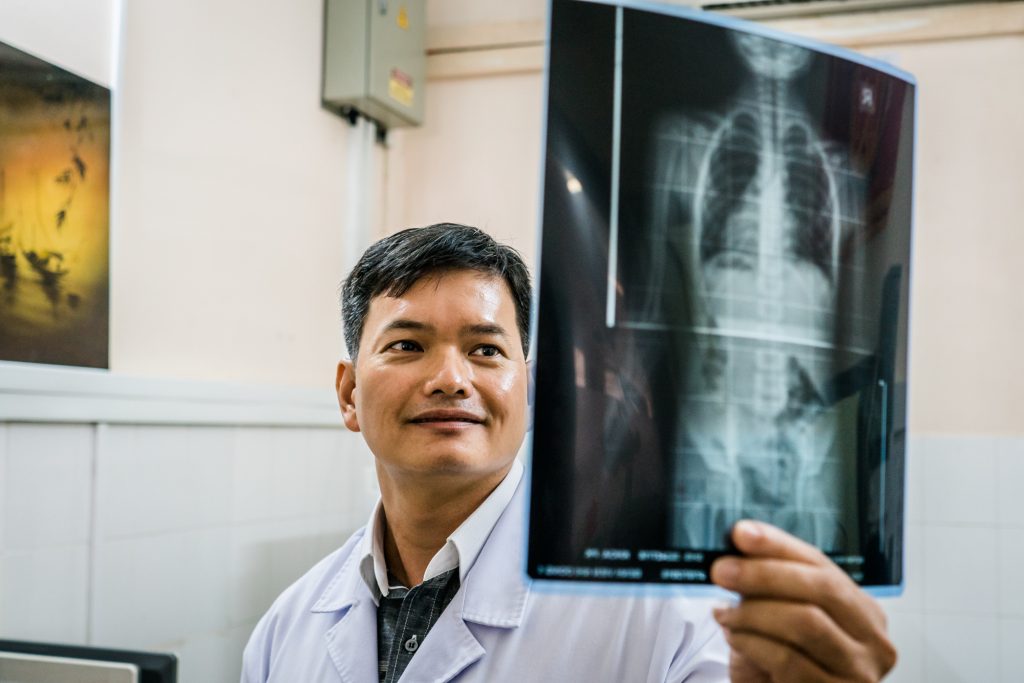 A doctor checks an X Ray at a hospital in Ho Chi Minh City, Vietnam