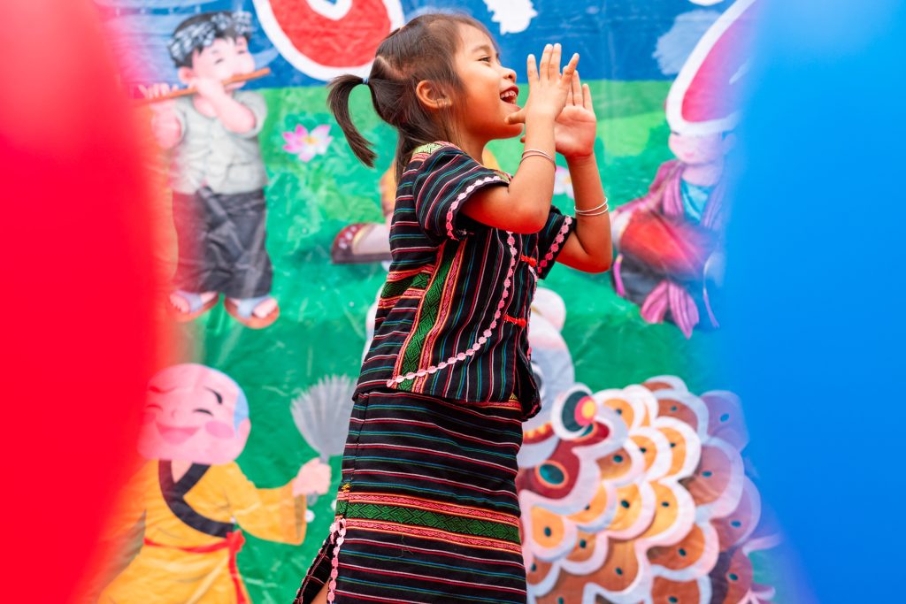 A ethnic minority girl puts on a school performance in Dak Lak, Vietnam