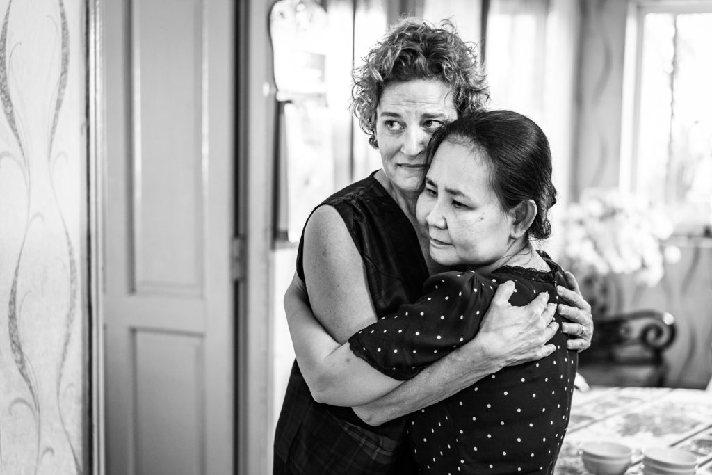 Women who both lost their fathers in the Vietnam war, on opposite sides of the conflict