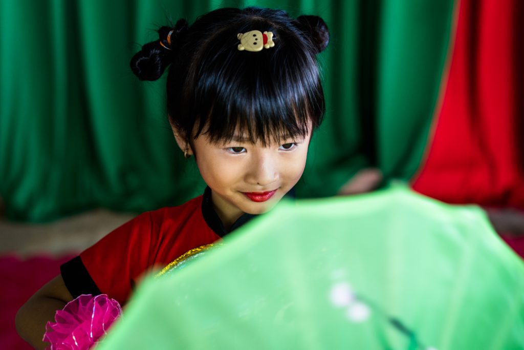A young girl practices her dance for a school performance