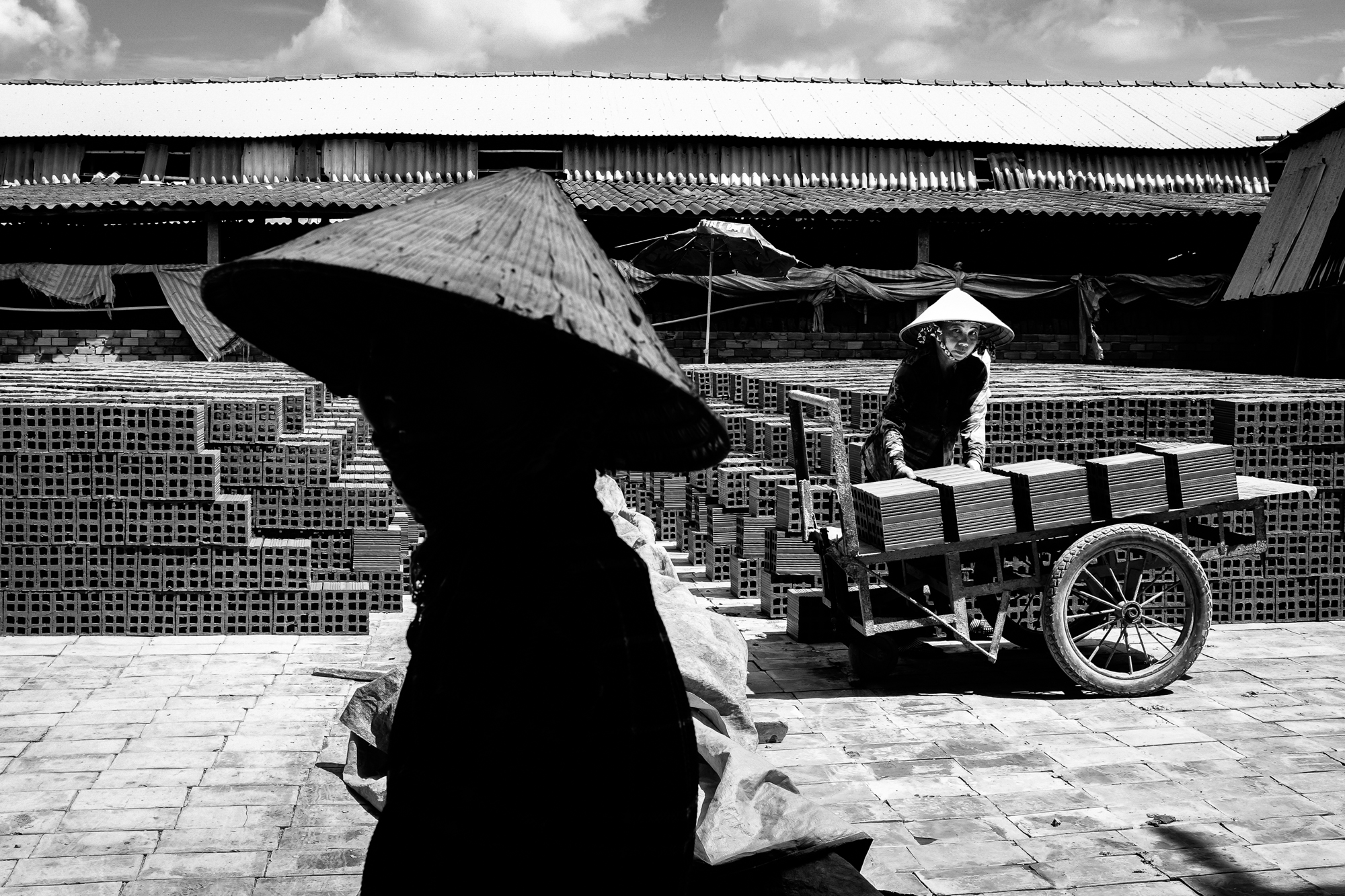 Women in a brick making factory in the Mekong Delta region of Vietnam.