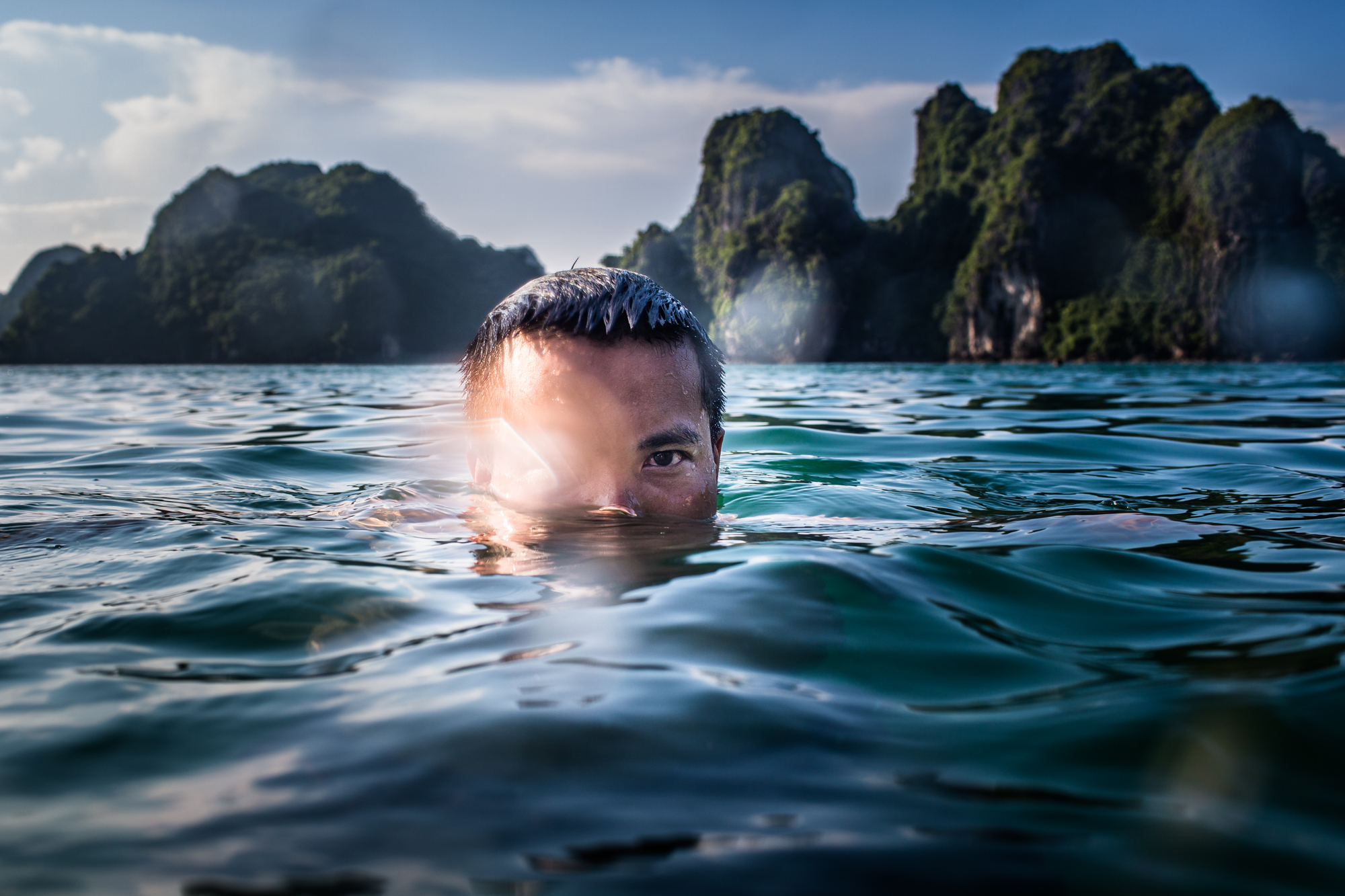 A man swims in Halong Bay, Vietnam