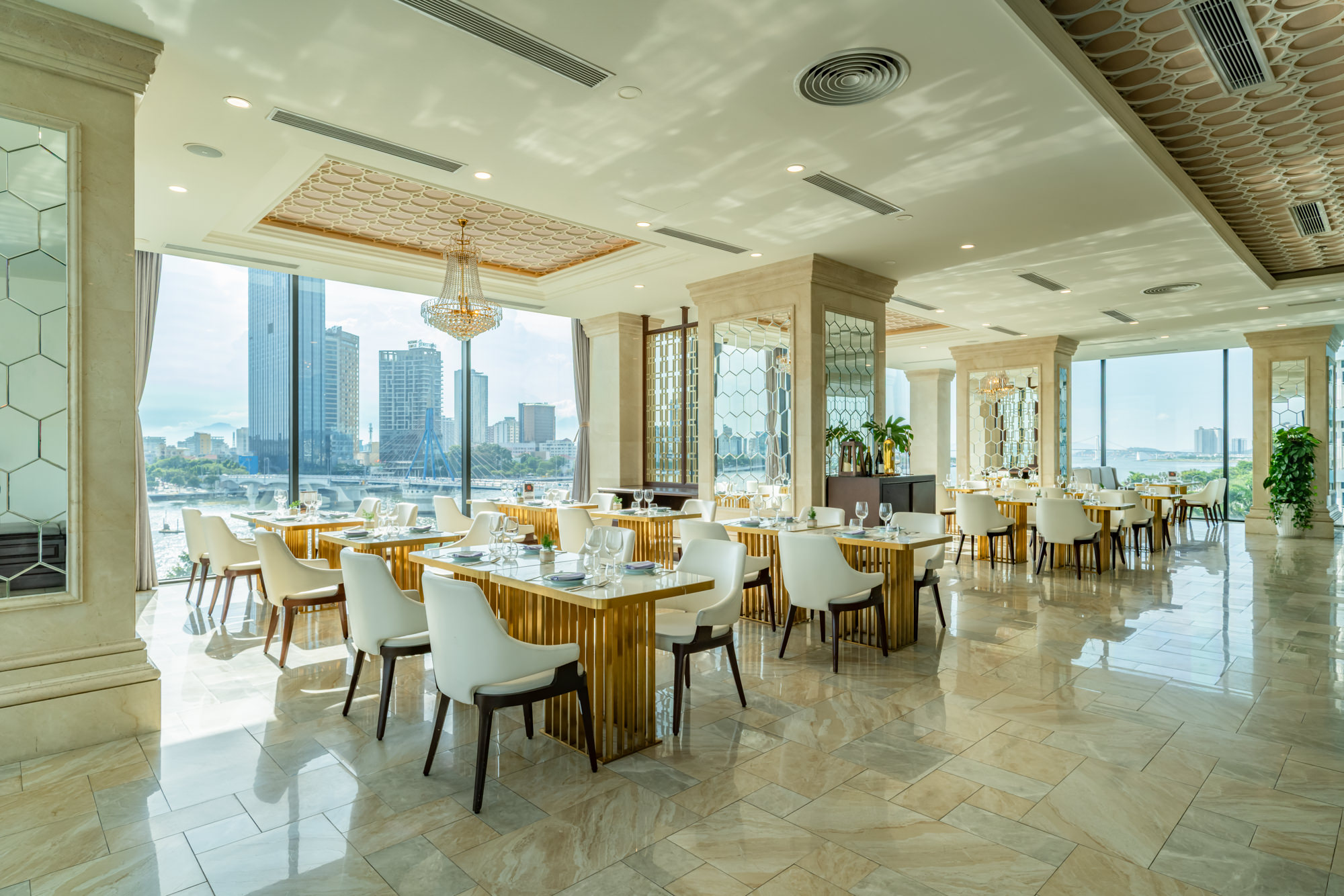 Sweeping river views to accompany a refined menu await guests at a five star hotel in Danang, Vietnam.